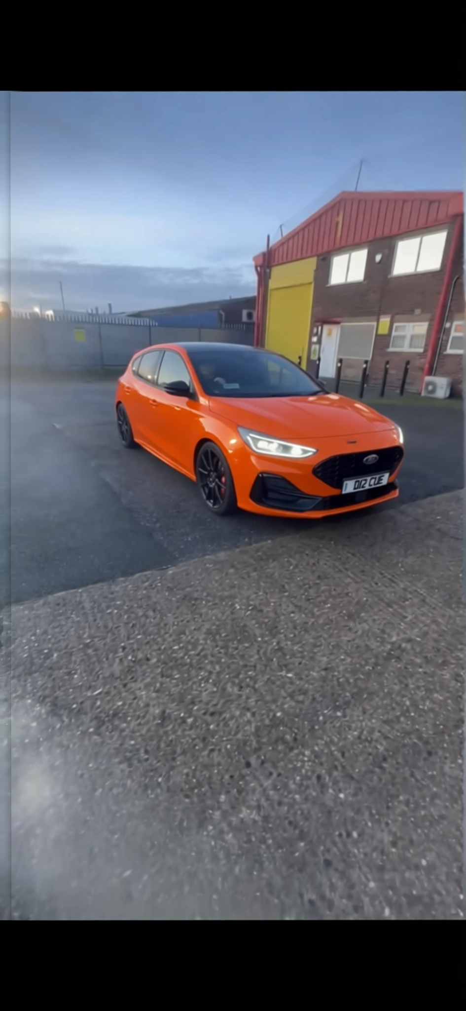 Ford Focus rendered in Lava Orange gloss paint